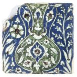 A 16th century tile, Damascus, Syria,circa 1560, designed with a vase, with Chinese-cloud, tulips