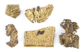 An interesting collection of yellow metal medieval plaque sections, each of thin metal, two