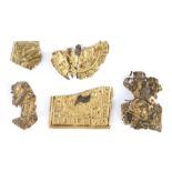 An interesting collection of yellow metal medieval plaque sections, each of thin metal, two