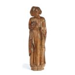 An interesting 15th/16th century carved walnut figure of male saint, circa 1490-1520, probably