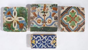Four 16th century tiles, Seville, Spain, circa 1520-30, a rectangular example with strapwork and