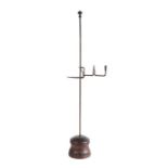 A floor standing iron rushlight and small candle holder, circa 1800, the iron stem with ball finial