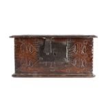 A small mid-17th century boarded oak box, English, circa 1650, the one-piece lid with ovolo-moulded