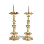 A pair of mid-17th century brass pricket candlesticks, German or Flemish, circa 1650 Each having a