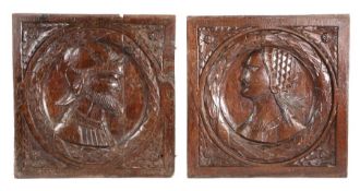 A good pair of  Henry VIII oak Romayne-type portrait panels, circa 1530, each with a carved bust