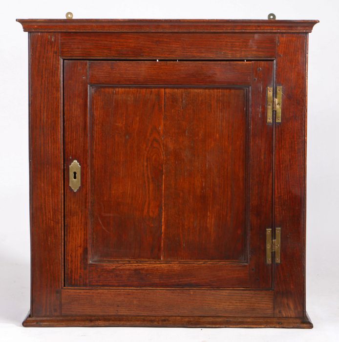 A George II joined oak wall cupboard, circa 1750, having a single-panelled cupboard door, framed by - Image 2 of 4