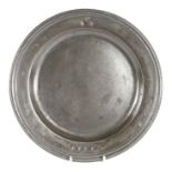 A late 17th century pewter multi-reed rim-plate, English, circa 1685 With hallmarks to front rim and