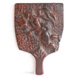 A rare Charles II walnut carved  hornbook, circa 1670, of paddle-form,  decorated to the rear with