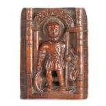 A small 17th Century boxwood carving, designed as a male Saint standing beneath an archway, with