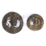 Two 14th century pewter pilgrims' badges, both with the bust of a male, one Thomas Becket, each