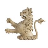 An interesting  pine and painted lion rampant crest, probably 18th century, with open mouth,