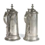 A near pair of GEORGE III PEWTER SPIRE FLAGONS, CIRCA 1760 By William Charsley, London (fl. 1729 -