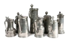 Eight 18th/19th century pewter flagons, to include a wrigglework example, dated 1819, another dated