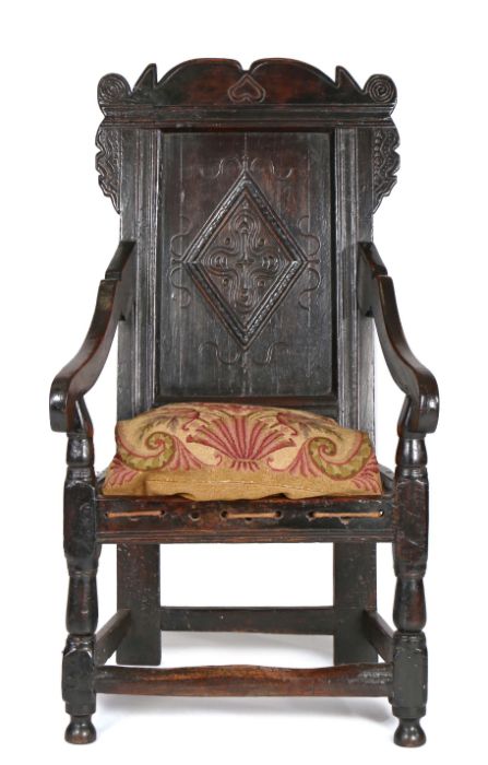 Charles II joined oak panel-back open armchair, Yorkshire, circa 1670, the back panel carved with