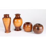 Four pieces of treen, to include two lignum vitae chogging blocks, both 8,5cm high, together with