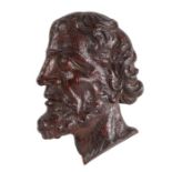 A 16th century well-carved oak male bust appliqué With moustache, beard, and flowing hair Height