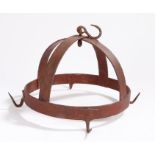 A wrought iron game hanger, of crown form, the circular frame with four hooks, red paint, 26cm wide