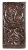 A good Henry VIII carved oak Romayne-type panel, circa 1530, designed with a male bust, wearing a