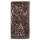 A good Henry VIII carved oak Romayne-type panel, circa 1530, designed with a male bust, wearing a