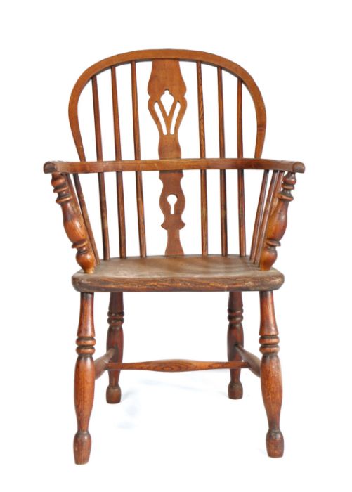 A mid-19th century ash and elm Windsor armchair, circa 1840, the hooped back with pierced splat and