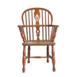 A mid-19th century ash and elm Windsor armchair, circa 1840, the hooped back with pierced splat and