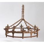 A Gothic-Revival wrought-iron chandelier, of crown form, hung on four chains, the six candle