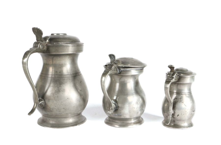 Three pewter Imperial Scottish baluster measures, circa 1830 To include a Glasgow pint; an Edinburgh