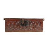 A mid-17th century oak boarded box, English, circa 1650, with rectangular  hinged lid, the front