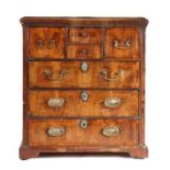 A small George II pine and walnut-veneered chest of drawers, East Anglian, the rectangular top