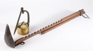 An early 19th century adjustable iron & oak ratchet crusie lamp, together with a 19th century brass