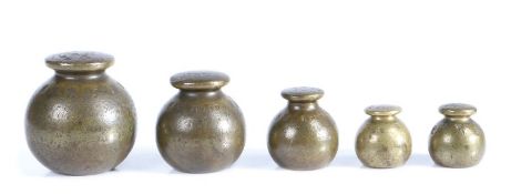 A Victorian set of graduated brass weights, 7lb, 4lb, 2lb, 1lb, 1lb, of globular form, marked in