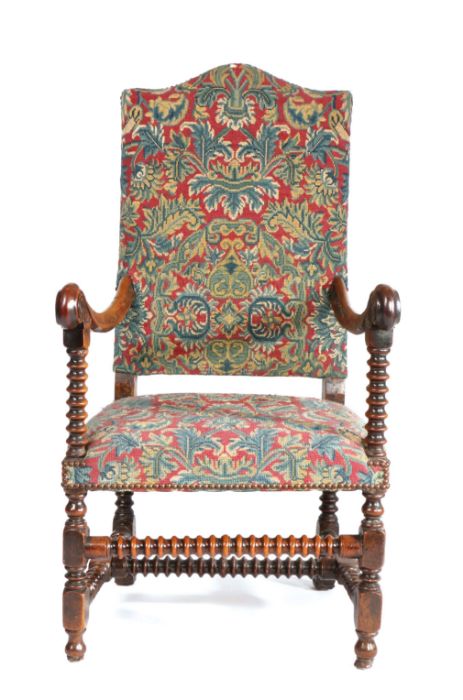 A 17th century fruitwood and needlework upholstered open armchair, Flemish, circa 1680-1700, the