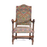 A 17th century fruitwood and needlework upholstered open armchair, Flemish, circa 1680-1700, the