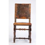 A mid-17th Century oak and hide upholstered side chair,  the square back with studded hide above a