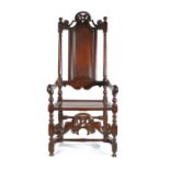 A good William & Mary joined oak open armchair, circa 1690, the part open back with arched fielded