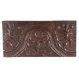 A Henry VIII carved oak parchemin-type panel, circa 1520 Having a prominent and punched decorated