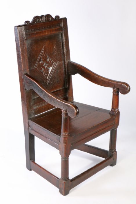 A Charles I joined oak panel-back open armchair, West Country, circa 1640 The back panel centred by - Image 2 of 3
