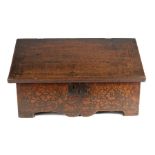 A rare and impressive Elizabeth I mastic composition inlaid oak desk box, circa 1580, the inlay in