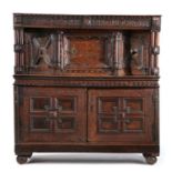 An oak, parquetry and marquetry inlaid court cupboard, dated 1655 but probably part Elizabethan,