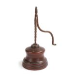 A 19th century iron and oak/elm table rush light holder, the iron nips with twist stem and