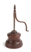 A 19th century iron and oak/elm table rush light holder, the iron nips with twist stem and
