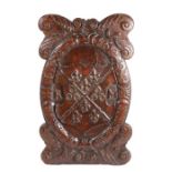 An 18th century carved oak Coat of Arms, with carved shield  to the centre and the initials RM