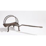 An early 19th century iron down hearth revolving toaster, circa 1800, with twin arched base above a