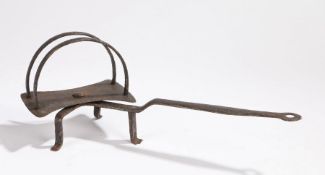 An early 19th century iron down hearth revolving toaster, circa 1800, with twin arched base above a