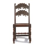 Charles II oak backstool, Yorkshire, circa 1670 having a pair of arched and cusp-carved splats, with