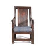A joined oak panel-back open armchair, Welsh, circa 1700, having a plain back panel inset between