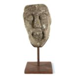 An interesting Romanesque carved stone head, probably Anglo-Norman, 12th century, West Country,