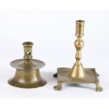 A 16th century capstan brass candlestick, of typical form, 13.5cm high, together with a late 17th