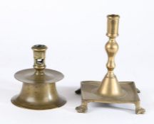 A 16th century capstan brass candlestick, of typical form, 13.5cm high, together with a late 17th