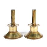 An unusual pair of sheet brass ejector ships' candlesticks, circa 1800-20 Each with a plain pillar
